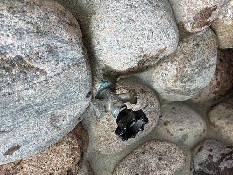 Completed comprehensive plumbing inspection of residential property to assess multiple fixture issues. Inspected leaking faucet at pedestal sink with chrome cross-handle fixtures, evaluated broken exterior hose bib, and assessed six existing toilets for replacement with comfort-height almond-colored units. Documented current conditions of plumbing fixtures and pipe insulation in utility areas, noting valve assemblies and existing infrastructure to provide accurate replacement estimates.