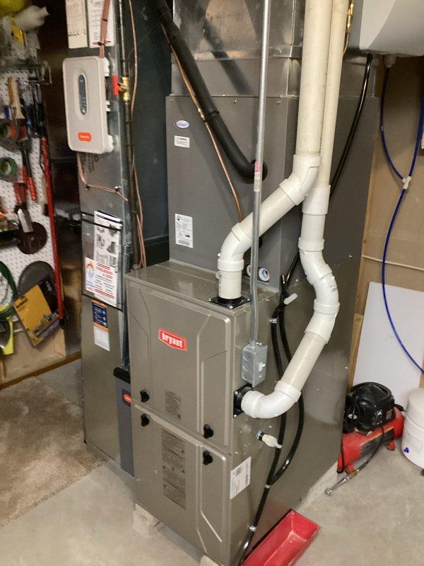 Completed prepaid membership cooling maintenance visit on residential Bryant HVAC system. Performed comprehensive inspection of indoor furnace unit and outdoor condensing unit, including visual assessment of all accessible components, electrical connections, refrigerant lines, and drainage systems. Connected manifold gauges to outdoor unit service ports to verify refrigerant pressures and system performance. Inspected capacitor, contactor, and wiring at outdoor unit with access panel removed. Verified proper operation of condensate drainage, PVC venting, and all mechanical components. System operating within normal parameters with no deficiencies noted.