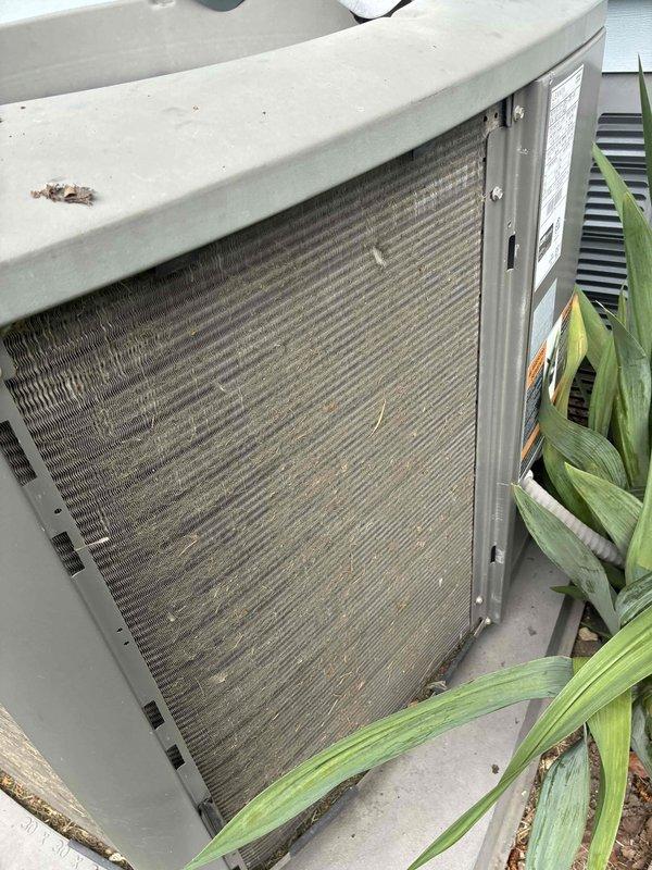 Completed routine cooling system maintenance visit as part of membership agreement. Performed comprehensive inspection of Lennox outdoor condensing unit, noting significant dirt and debris accumulation on condenser coil fins requiring attention. Addressed thermostat notification by replacing humidifier pad and furnace filter per maintenance schedule. All work completed according to preventive maintenance protocol to ensure optimal system performance for the cooling season.