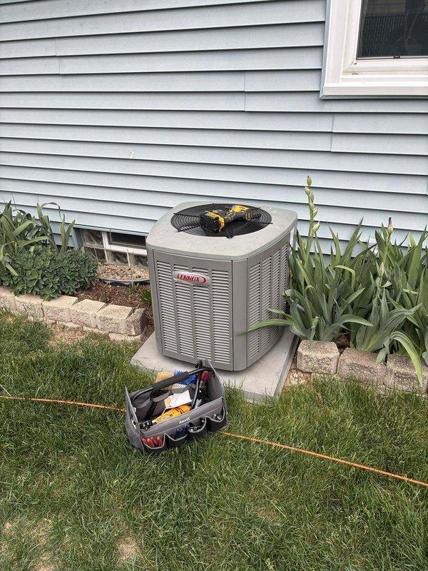 Completed routine cooling system maintenance visit as part of membership agreement. Performed comprehensive inspection of Lennox outdoor condensing unit, noting significant dirt and debris accumulation on condenser coil fins requiring attention. Addressed thermostat notification by replacing humidifier pad and furnace filter per maintenance schedule. All work completed according to preventive maintenance protocol to ensure optimal system performance for the cooling season.
