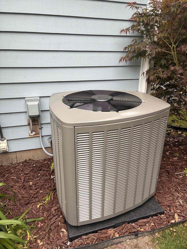 Completed air conditioning system start-up on residential outdoor condensing unit. Verified electrical disconnect, circuit breaker, and service valves were in proper operating positions. System was prepared for operation with R-454B refrigerant for 35-foot lineset configuration. Performed initial system activation and confirmed proper operation of compressor and condenser fan motor. Measured supply air temperature at floor register, which indicated system was producing conditioned air effectively. Unit is now operational and ready for normal use.
