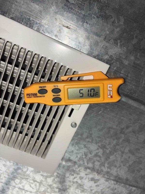Completed air conditioning system start-up on residential outdoor condensing unit. Verified electrical disconnect, circuit breaker, and service valves were in proper operating positions. System was prepared for operation with R-454B refrigerant for 35-foot lineset configuration. Performed initial system activation and confirmed proper operation of compressor and condenser fan motor. Measured supply air temperature at floor register, which indicated system was producing conditioned air effectively. Unit is now operational and ready for normal use.