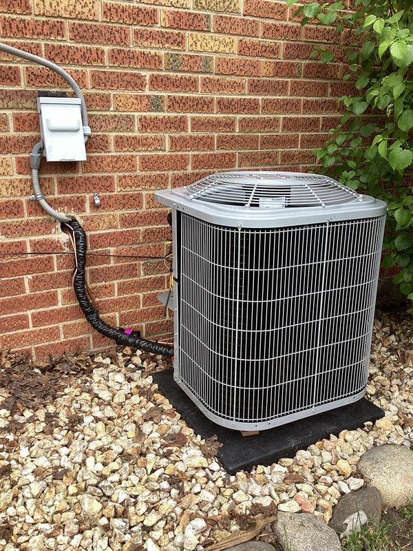 Completed full HVAC system installation including furnace, air conditioning unit, and water heater. Exterior condenser unit was professionally mounted on vibration-dampening pad with proper gravel base, electrical disconnect box installed per code, and refrigerant lines pressure-tested to 345 PSI to verify system integrity prior to startup.