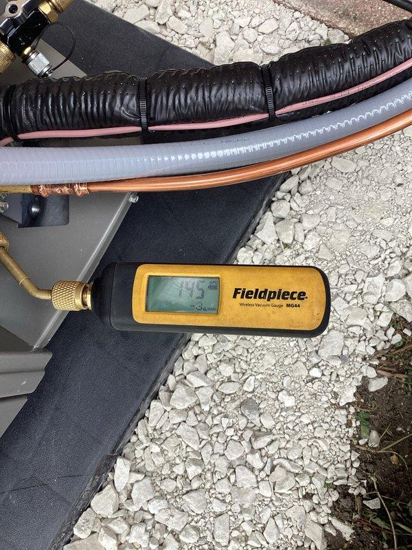 Completed new residential air conditioning system installation including outdoor condensing unit and indoor evaporator coil. System was properly charged with refrigerant using calibrated digital manifold gauges, with final weights verified on precision scale to ensure optimal charge levels. All refrigerant lines were insulated, secured with appropriate fasteners, and routed professionally from outdoor unit to indoor coil connection. Electrical connections completed, condensate drainage established, and system tested for proper operation with all readings within manufacturer specifications.