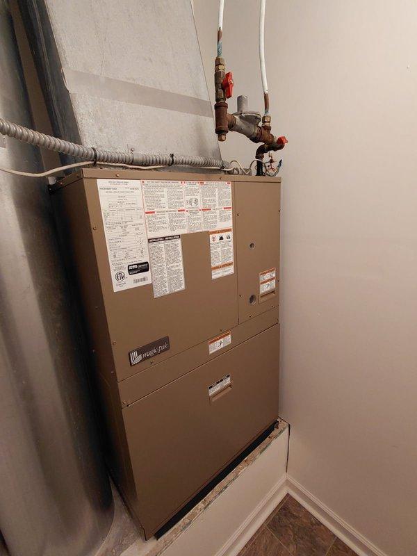 Completed routine tune-up and preventive maintenance on 2019 Magic-Pak combination HVAC unit installed in residential utility closet. Performed standard inspection of air handler, refrigerant lines, electrical connections, and condensate drainage system; collected equipment model and serial number information for membership program enrollment as requested.
