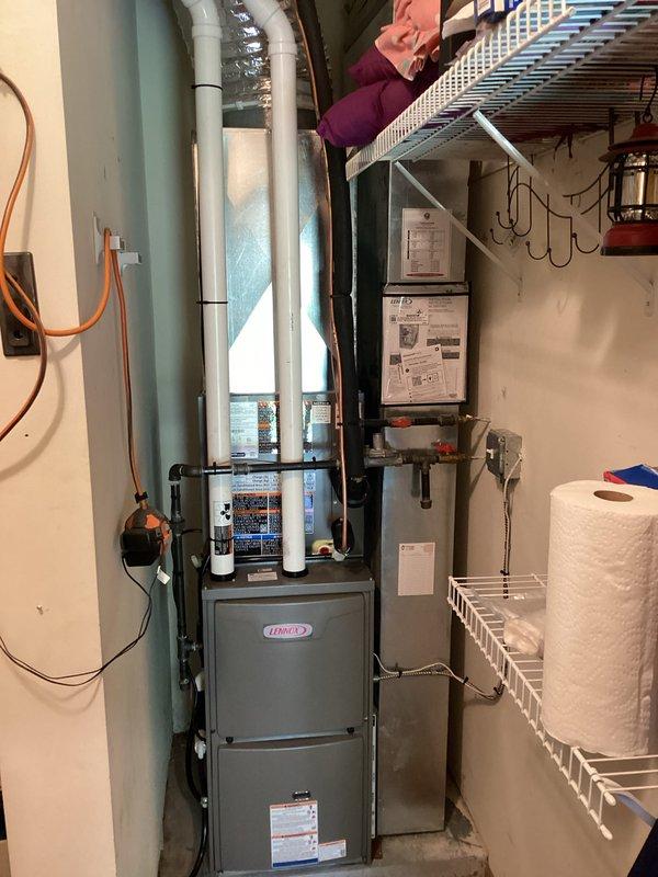 Completed full HVAC system installation including new Lennox furnace and outdoor air conditioning condenser unit. Installed furnace in basement utility area with proper PVC venting, electrical connections, and ductwork integration. Mounted AC condenser on concrete pad adjacent to home exterior with appropriate electrical conduit routing from building. Connected refrigerant lines, performed system startup, and verified proper pressures using manifold gauges. All equipment tested and operational upon completion.
