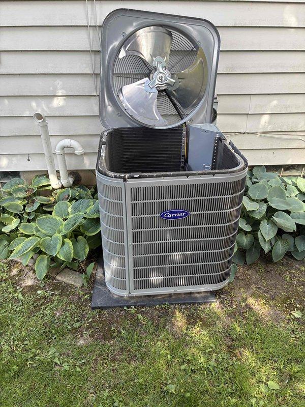 Completed preventive maintenance tune-up on Carrier outdoor condensing unit. Upon arrival, observed unit sitting slightly tilted on pad; brought and installed gravel base to level and stabilize equipment for proper operation. Performed standard diagnostic procedures including voltage testing, which confirmed system operating at 347V. Unit was recently installed with 10-year parts and 1-year labor warranty coverage in place.