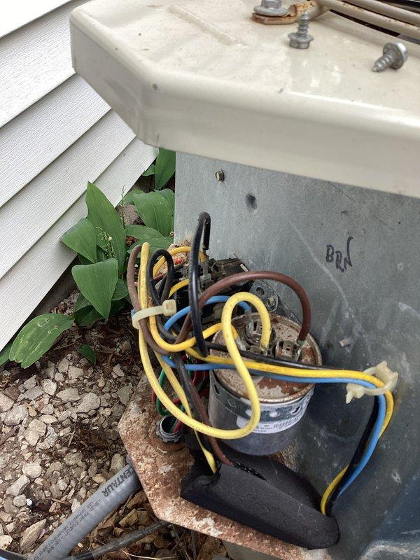 Performed comprehensive air conditioning tune-up on outdoor condensing unit. Upon arrival, found condenser coils heavily clogged with dirt, dust, and debris, significantly restricting airflow and reducing system efficiency. Cleaned condenser coils, inspected electrical components including capacitor and wiring connections, and documented equipment information for service records.