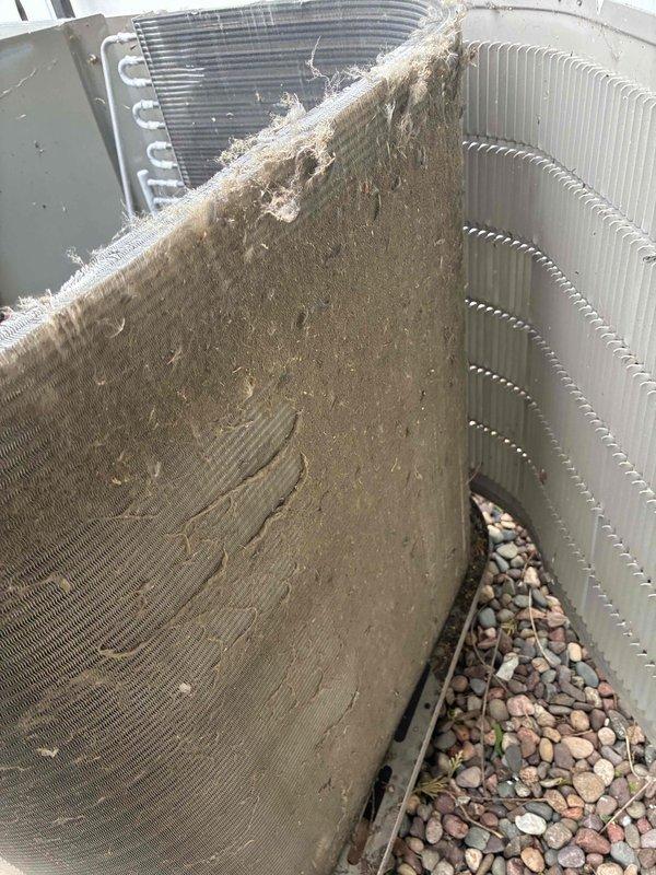 # HVAC Tune-Up Completed

Performed comprehensive air conditioning tune-up service on outdoor condensing unit. Upon arrival, discovered heavily soiled condenser coil with significant dirt, dust, and debris accumulation causing restricted airflow and reduced system efficiency. Thoroughly cleaned condenser coil sections, removing thick matted buildup from protective screens and aluminum fins to restore proper heat exchange capacity. Replaced two 16x25x4 media filters as requested to improve indoor air quality and system performance. All components inspected and system returned to optimal operating condition.