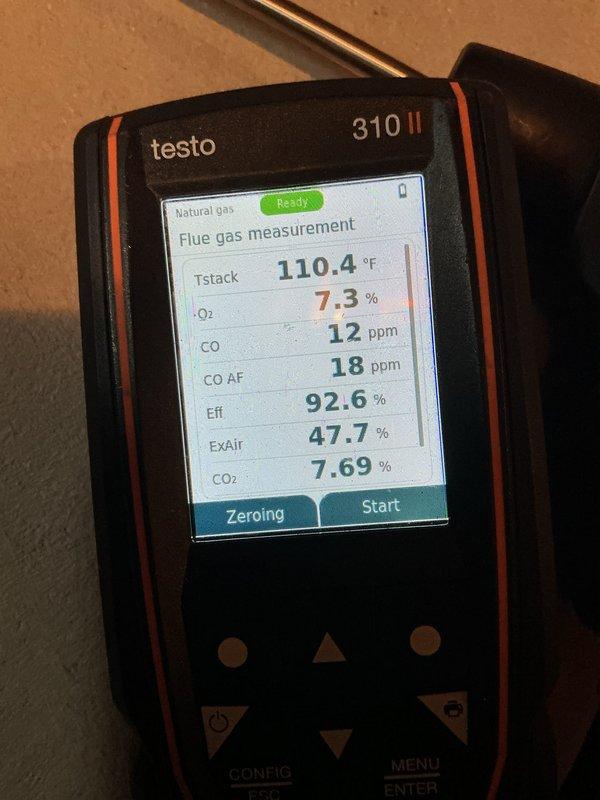 Completed annual tune-up on furnace system with arrival within scheduled window. Performed combustion analysis using Testo 310 II analyzer, recording efficiency at 92.6% with acceptable oxygen levels at 7.3%, carbon monoxide at 12 ppm, and CO2 at 7.69%. Inspected PVC condensate drain piping system and verified proper installation and functionality of all components.