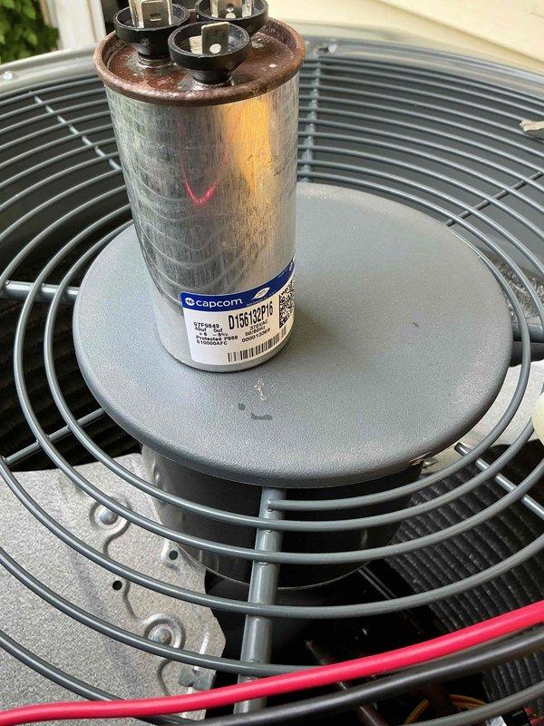 Completed prepaid membership cooling maintenance visit on residential air conditioning system. Performed comprehensive inspection of outdoor condenser unit, including evaluation of capacitor condition, fan operation, and overall system components. Capacitor showed signs of age with rust-colored discoloration on terminals but remained functional within acceptable parameters. Verified proper fan blade operation, inspected protective grills and housing integrity, and documented equipment condition through photographic records. Unit operating normally with no immediate repairs required at time of service.