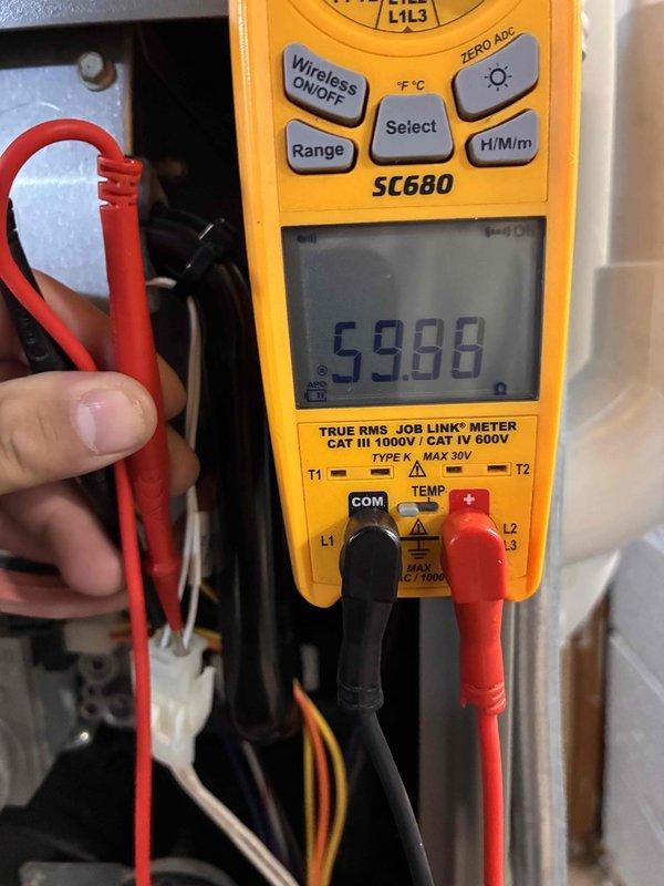 Completed comprehensive tune-up service on residential furnace and air conditioning system. Performed diagnostic temperature measurements using digital thermometer, recording supply air temperature of 93.0°F, and utilized true RMS multimeter to verify electrical readings at 59.88 volts across system components. All equipment tested and found operating within normal parameters.