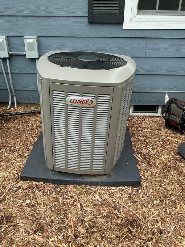 Completed scheduled cooling system maintenance visit on Lennox outdoor condensing unit as part of prepaid membership program. Performed comprehensive inspection of unit components, verified proper operation of compressor and condenser fan motor, and documented system condition with photographic evidence showing unit installed on composite pad with appropriate electrical disconnects and clearances maintained.