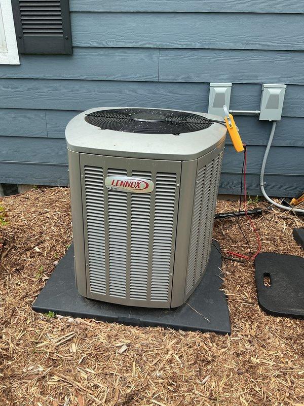 Completed scheduled cooling system maintenance visit on Lennox outdoor condensing unit as part of prepaid membership program. Performed comprehensive inspection of unit components, verified proper operation of compressor and condenser fan motor, and documented system condition with photographic evidence showing unit installed on composite pad with appropriate electrical disconnects and clearances maintained.