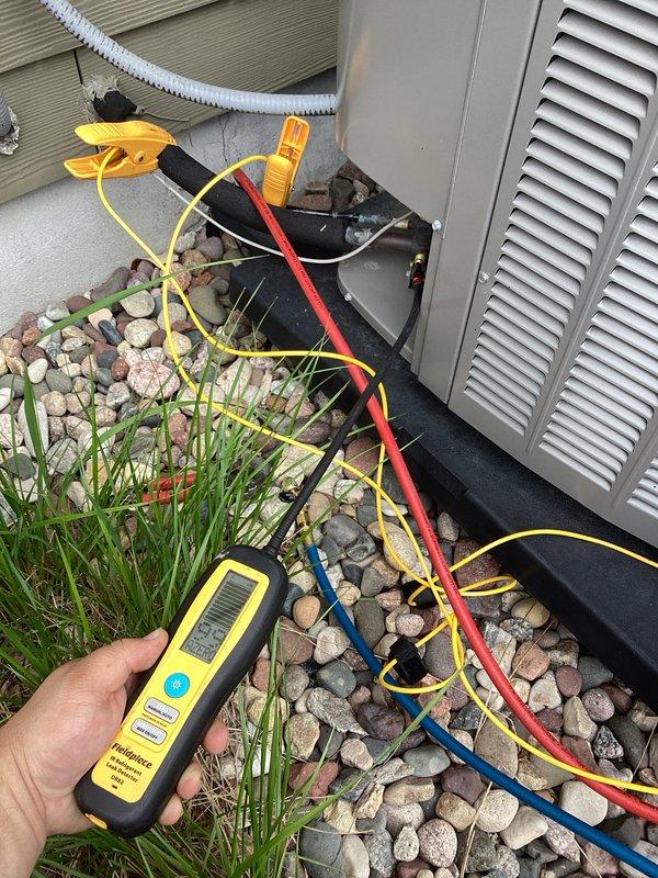 Responded to no-cooling complaint where system was running continuously but unable to maintain setpoint, with indoor temperature rising to 76°F despite thermostat set at 72°F. Performed diagnostic evaluation of outdoor condensing unit using digital multimeter and refrigerant testing equipment to measure electrical values and assess system performance. Connected diagnostic gauges to service ports to check refrigerant pressures and determine root cause of inadequate cooling capacity.