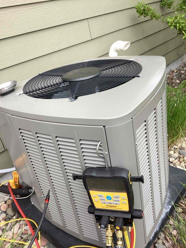Responded to no-cooling complaint where system was running continuously but unable to maintain setpoint, with indoor temperature rising to 76°F despite thermostat set at 72°F. Performed diagnostic evaluation of outdoor condensing unit using digital multimeter and refrigerant testing equipment to measure electrical values and assess system performance. Connected diagnostic gauges to service ports to check refrigerant pressures and determine root cause of inadequate cooling capacity.