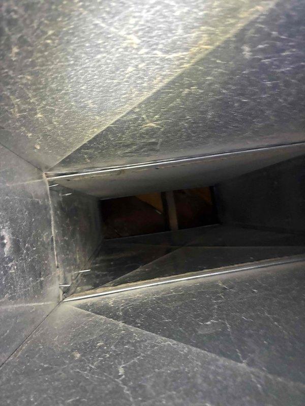 Responded to no heat call and performed diagnostic inspection of HVAC system. Found extensive dust and debris accumulation throughout ductwork and air handling components, restricting airflow. Tested electrical components with multimeter, confirming proper voltage readings of 232V at system connections. System restored to operational status following inspection and testing procedures.
