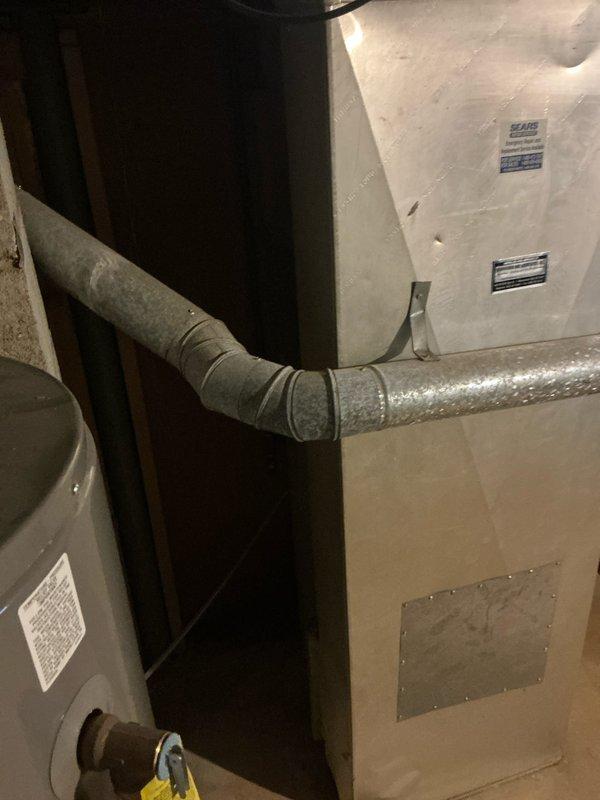 Responded to emergency service call for air conditioning system running low on refrigerant. Performed comprehensive system evaluation and provided detailed replacement estimate for existing AC unit. Documented electrical panel configuration and existing HVAC equipment installation, including furnace/air handler unit and associated ductwork in mechanical room.