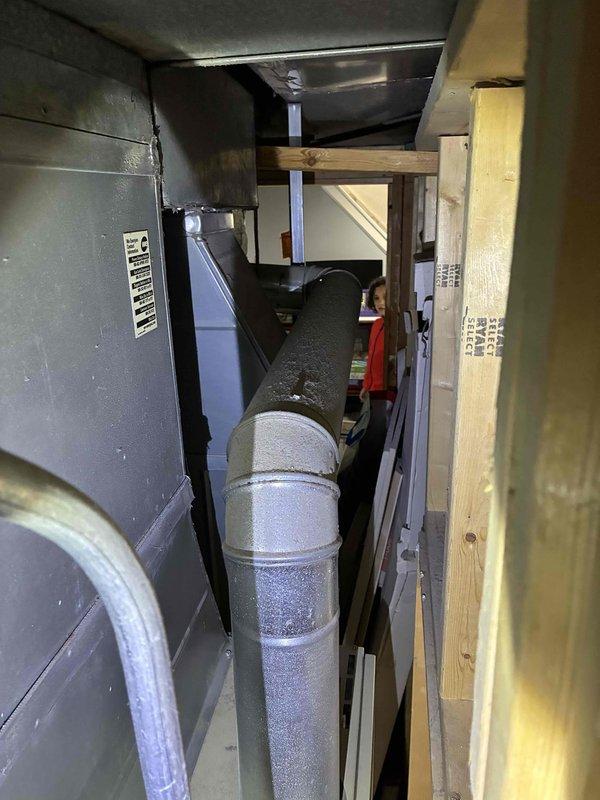 Conducted on-site assessment of existing furnace and air conditioning system located in basement mechanical room. Evaluated current HVAC equipment positioned in confined space between painted brick walls, documented equipment specifications, and provided estimate for complete furnace and AC replacement with natural gas furnace unit including necessary ductwork modifications.