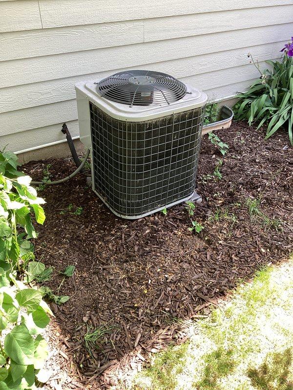 # HVAC Service Report

Responded to no cooling complaint on residential air conditioning system. Upon arrival, performed diagnostic testing of outdoor condensing unit using refrigerant manifold gauges and digital temperature measurement equipment. 

Diagnostic readings revealed abnormally high discharge temperature of 265.5°F and elevated system pressures, indicating potential compressor failure or severe refrigerant system restriction. High-side temperature of 119°F confirmed system operating outside normal parameters. Connected manifold gauge set to service ports and monitored system pressures during operation to verify compressor performance and refrigerant charge levels.

Documented equipment conditions with photographic evidence showing condenser unit installation and diagnostic tool readings for customer review. Recommend further evaluation to determine if compressor replacement or additional refrigerant system repairs are required to restore proper cooling operation.