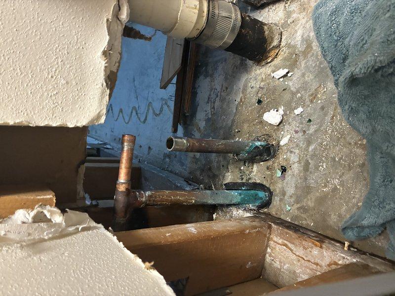 Responded to emergency plumbing call for leaking pipe within residence. Upon arrival, conducted diagnostic inspection and located source of leak in copper piping system showing significant corrosion and verdigris buildup. Assessed damaged pipe section and corroded fittings on rooftop mechanical installation area. Performed necessary repairs to stop active leak, replaced compromised pipe section and corroded coupling fitting. Cleaned work area and tested system to verify proper function and confirm no additional leaks present.