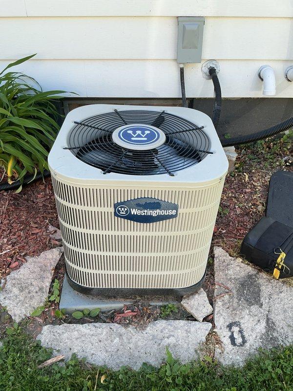 Completed comprehensive air conditioning tune-up on residential Westinghouse cooling system. Performed standard maintenance procedures including inspection of indoor furnace unit, outdoor condenser unit, refrigerant lines, electrical connections, and air filtration system. All components found operating within normal parameters with no deficiencies noted.