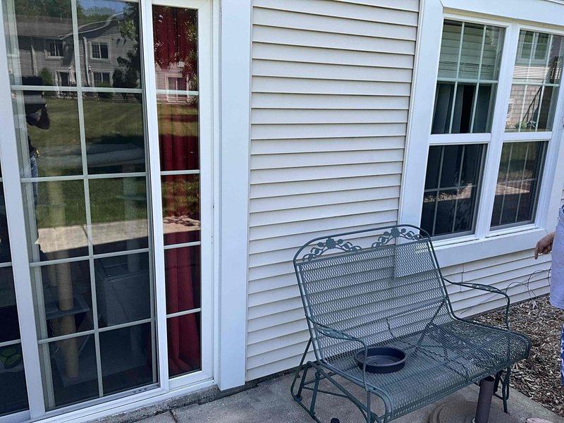 Conducted on-site assessment for mini split installation at residential property. Evaluated exterior wall locations and documented proposed installation areas including patio access points and exterior mounting surfaces on vinyl-sided structure for outdoor condenser unit placement and indoor air handler positioning.