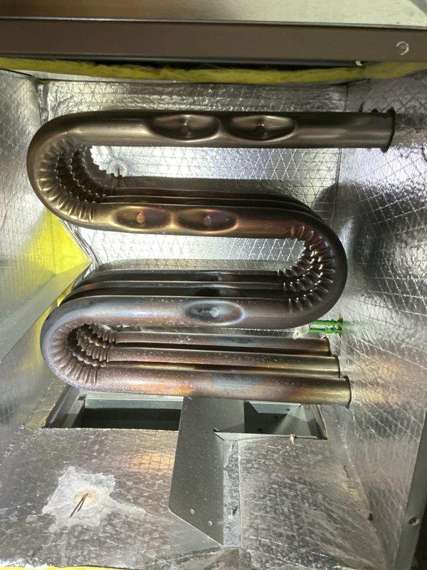 Completed comprehensive tune-up maintenance on residential Magicpak combination heating and cooling unit. Inspected serpentine heat exchanger coil assembly, verified proper operation of all components, and confirmed system is functioning within manufacturer specifications.