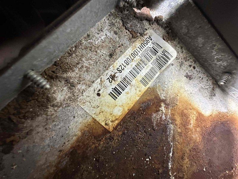 Conducted on-site evaluation for complete HVAC system replacement. Assessed existing outdoor condensing unit showing severe corrosion and rust damage on cabinet housing, with model number SC16020U109232 documented. Inspected indoor ductwork system in basement area, noting rigid insulation board construction extending floor to ceiling. Provided comprehensive replacement estimate covering complete system removal and installation of new equipment to address aging infrastructure and deteriorated components.