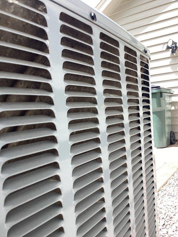 Completed furnace tune-up and air conditioning tune-up on residential HVAC system. Inspected outdoor condenser unit, verified electrical connections and controls including ComSense computer module, checked contactor operation, and confirmed proper system function with no issues identified.