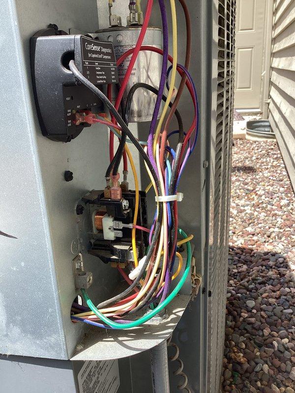 Completed furnace tune-up and air conditioning tune-up on residential HVAC system. Inspected outdoor condenser unit, verified electrical connections and controls including ComSense computer module, checked contactor operation, and confirmed proper system function with no issues identified.