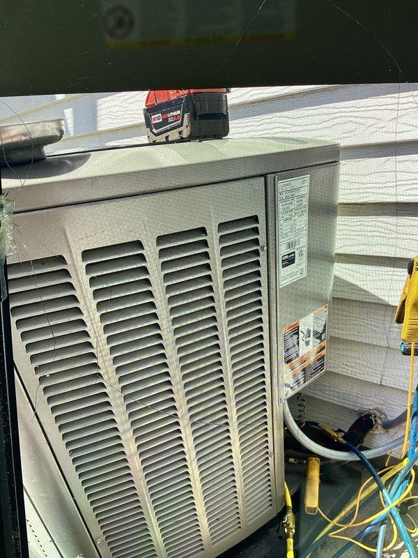 Performed comprehensive furnace and air conditioning tune-up at residential property. Connected Fieldpiece SMAN refrigerant manifold and micron gauge to outdoor condensing unit to verify R410A system pressures and performance metrics, with readings indicating 211 psig suction and 223 psig discharge pressures within acceptable operating range. Completed standard maintenance procedures including refrigerant charge verification, electrical component inspection, and system operational testing to ensure optimal heating and cooling performance for the upcoming season.