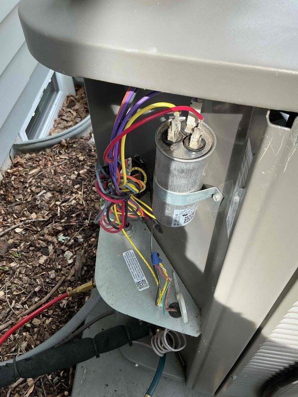 Completed comprehensive AC tune-up on outdoor condensing unit. Performed electrical inspection of contactor and dual-run capacitor, verified all wire connections secure, and used refrigerant manifold gauges to check system pressures and confirm proper R-410A refrigerant charge levels. Unit operating within manufacturer specifications with no deficiencies noted.