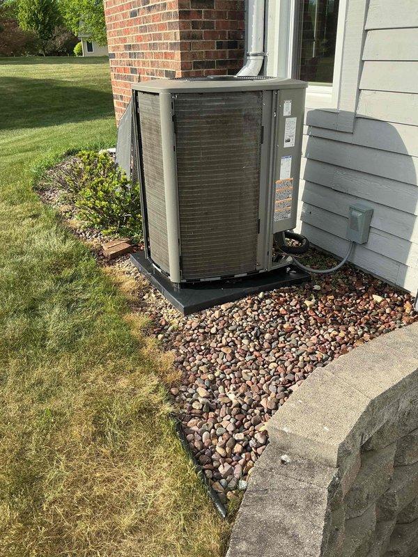 # HVAC Maintenance Summary

Completed routine cooling system maintenance visit under membership agreement. Performed comprehensive A/C tune-up on outdoor condensing unit, which exhibited heavy dirt and debris accumulation on condenser coils requiring thorough cleaning to restore optimal heat transfer efficiency and system performance.

# Detailed Work Performed

Arrived on-site and conducted visual inspection of outdoor air conditioning condensing unit positioned on residential property exterior. Unit accessed by opening front service panel to evaluate internal components and overall system condition.

**Primary Findings:**
- Condenser coils displayed significant accumulation of dirt, dust, and debris buildup
- Heavy soiling observed with thick brownish material covering substantial portions of coil surface
- Left and center coil sections showed particularly dense contamination
- Dark discoloration in multiple areas indicating prolonged dirt accumulation
- Restricted airflow conditions