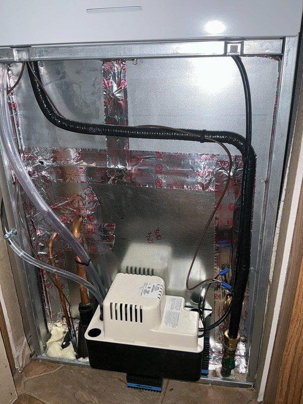 Conducted comprehensive site evaluation of existing outdoor AC condenser unit and indoor air handler system for replacement estimate. Documented current equipment condition, including aging outdoor unit with visible wear, refrigerant line configuration, and indoor mechanical cabinet containing condensate pump assembly with associated drainage components and electrical connections.