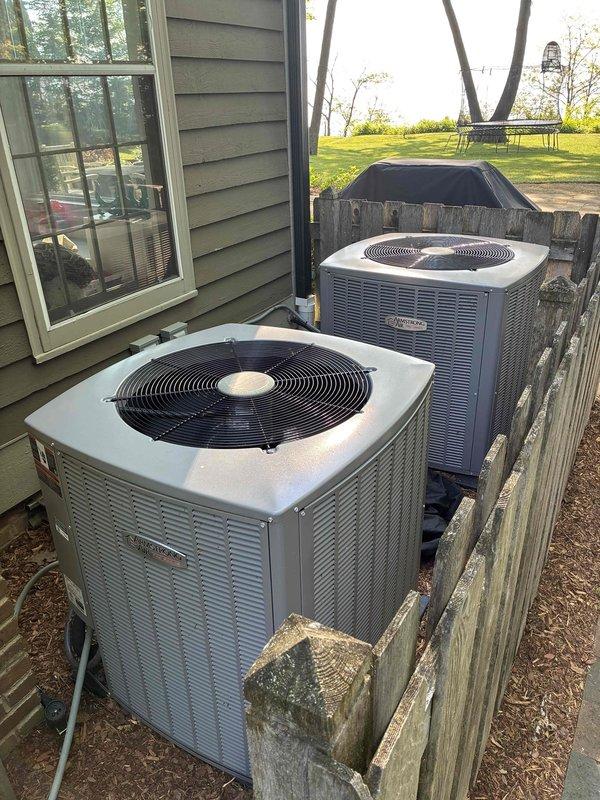 Completed routine maintenance on two outdoor air conditioning condenser units as part of prepaid membership cooling visit. Performed comprehensive tune-up procedures on both systems, including temperature diagnostics with digital thermometer showing 97.1°F reading at condenser unit. Both units operational and functioning within normal parameters following maintenance completion.