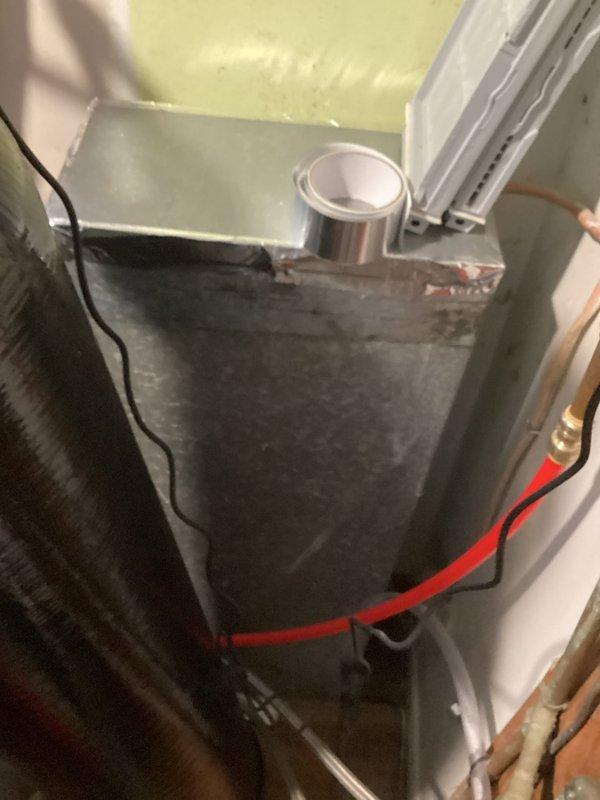 Completed comprehensive mechanical room inspection for new homeowner experiencing multiple system issues. Evaluated central air conditioning system, including air handler unit, refrigerant lines, and ductwork connections. Inspected furnace installation, mounting hardware, and electrical connections. Assessed water softener system and related plumbing components. 

Identified chimney connection requiring attention and provided recommendation for proper venting modifications to ensure safe operation of heating equipment. Documented existing HVAC equipment condition, noting standard installation configuration with metallic ductwork secured with proper strapping. Verified air handler mounting, drainage system components, and copper refrigerant line routing. Observed wall-mounted auxiliary equipment with copper piping connections in utility area.

Recommended chimney service to address venting concerns for optimal system performance and safety compliance.