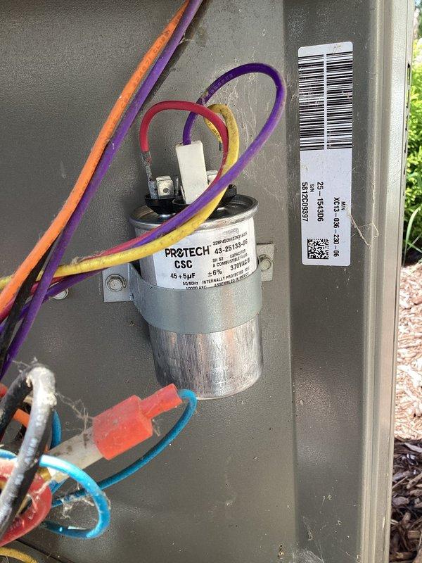 Responded to no-cool call where system was not running and had been blowing warm air the previous evening. Upon arrival, performed diagnostic evaluation and found failed dual-run capacitor (45+5µf PROTECH CSC) preventing compressor and condenser fan operation. Verified supply air temperature of 66.5°F at indoor unit, confirming lack of cooling. Replaced defective capacitor, restored power to unit, and verified proper compressor and outdoor fan motor operation with normal amp draws and system cycling.