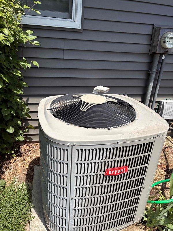 Completed comprehensive air conditioning tune-up on Bryant outdoor condensing unit, including system performance evaluation and replacement of dirty air filters. All components inspected and found operating within normal parameters, with unit properly maintaining cooling capacity for continued efficient operation.