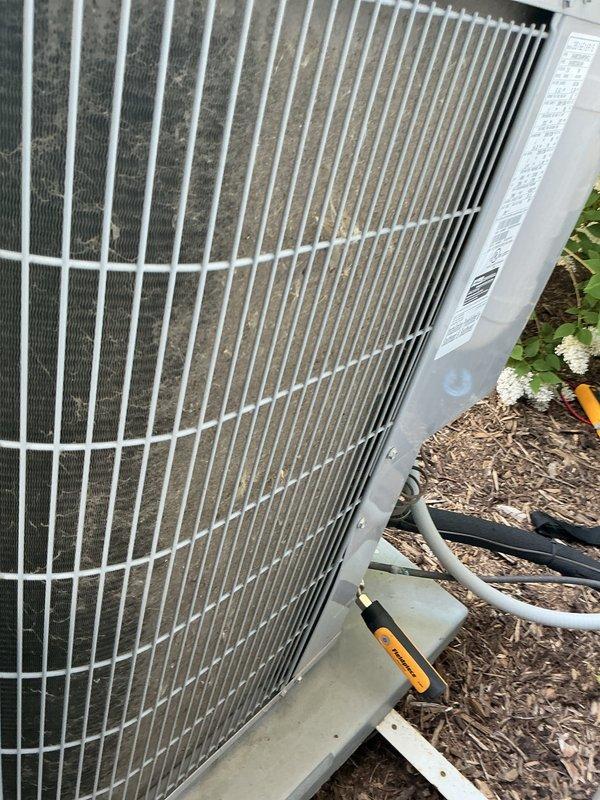 Completed comprehensive air conditioning tune-up service on residential Carrier HVAC system. Performed standard maintenance procedures including inspection of indoor furnace unit and outdoor condenser, verified proper operation of all components, checked refrigerant lines and connections, and documented system condition with photographs showing equipment in good working order with no immediate concerns identified.