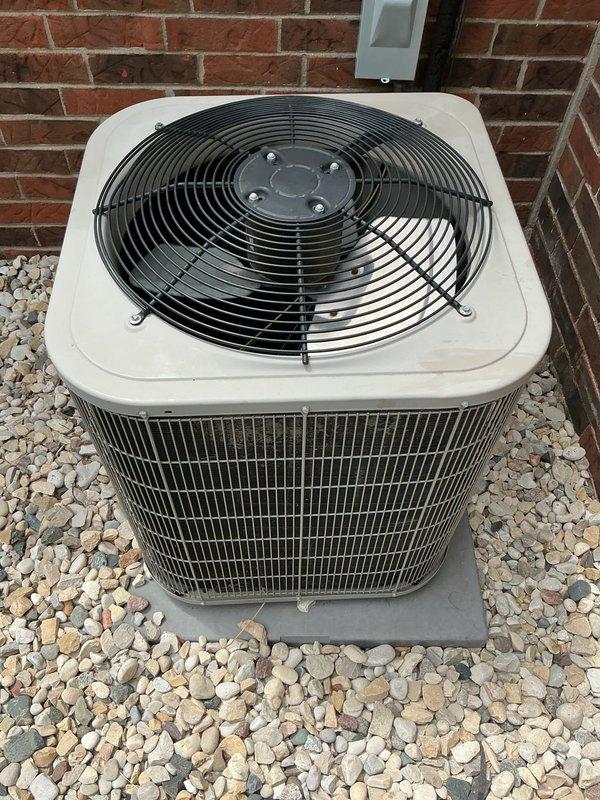 Responded to no cooling complaint in office area. Inspected Carrier HVAC system including outdoor condenser unit and indoor air handler. Condenser unit operating properly with fan motor running and coils clean, no visible damage or refrigerant leaks detected. Verified indoor unit components functioning correctly. System restored to normal cooling operation.