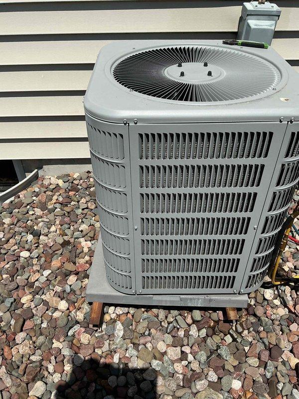 Completed preventive maintenance tune-up on outdoor AC condenser unit. Performed comprehensive system inspection, tested electrical components including capacitor readings with multimeter showing proper values, verified compressor operation, and confirmed all mechanical and electrical systems functioning within manufacturer specifications.