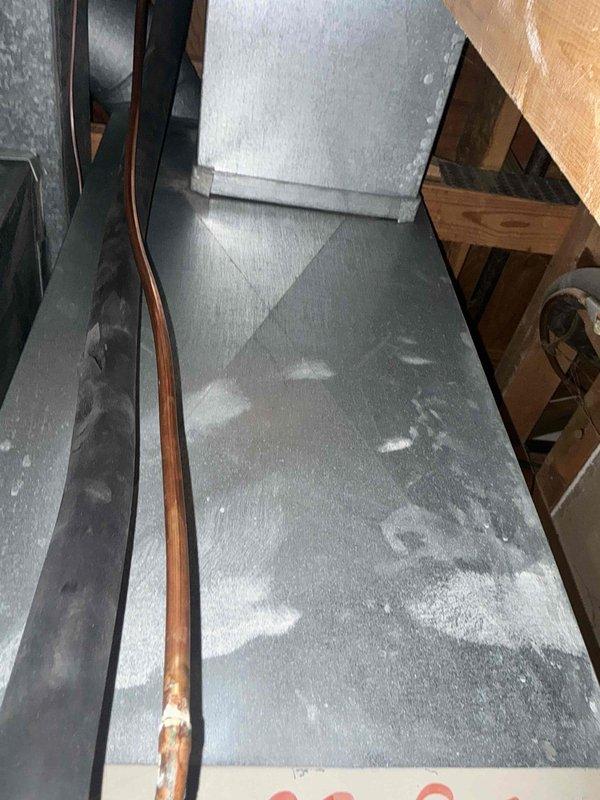 Conducted estimate for non-operational natural gas furnace located in basement. Inspected existing HVAC system including air handler, refrigerant lines showing visible corrosion and oxidation, and ductwork with moisture patterns indicating potential condensation issues. Provided replacement options and recommendations for complete furnace system replacement.