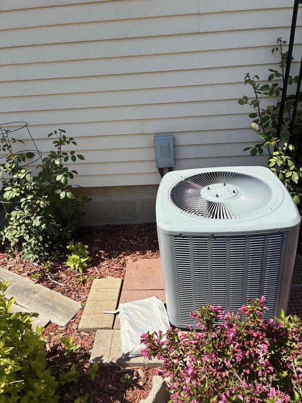 Responded to no cooling complaint on residential air conditioning system. Upon arrival, performed diagnostic testing using digital multimeter to measure electrical values and system performance on outdoor condensing unit. Evaluated unit operation and documented equipment condition with photos of outdoor unit installed on concrete pad with proper clearances. System tested and measurements recorded for customer review.