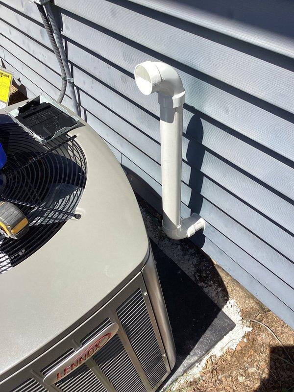 Completed full HVAC system installation including Trane heat pump outdoor unit mounted on concrete pad with proper clearances and leveling. Installed refrigerant line set with protective conduit, electrical connections, and PVC condensate drain line with proper termination and pitch. System was charged, tested, and verified operational with all safety checks performed and diagnostic measurements confirming proper system performance.