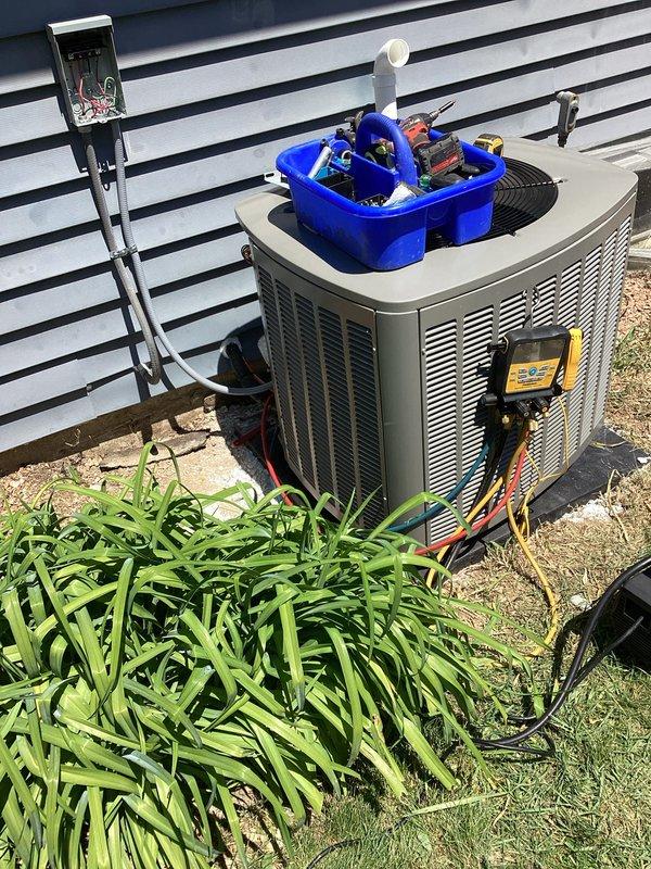 Completed full HVAC system installation including Trane heat pump outdoor unit mounted on concrete pad with proper clearances and leveling. Installed refrigerant line set with protective conduit, electrical connections, and PVC condensate drain line with proper termination and pitch. System was charged, tested, and verified operational with all safety checks performed and diagnostic measurements confirming proper system performance.