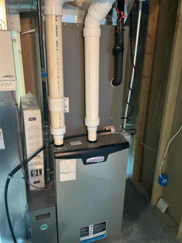 Completed annual air conditioning tune-up and preventative maintenance service on residential split-system HVAC equipment. Performed comprehensive inspection of outdoor condenser unit and indoor Lennox furnace system, verified proper operation of all components, checked refrigerant levels, cleaned condenser coils, inspected electrical connections and disconnect box, and confirmed adequate airflow through both indoor and outdoor units.
