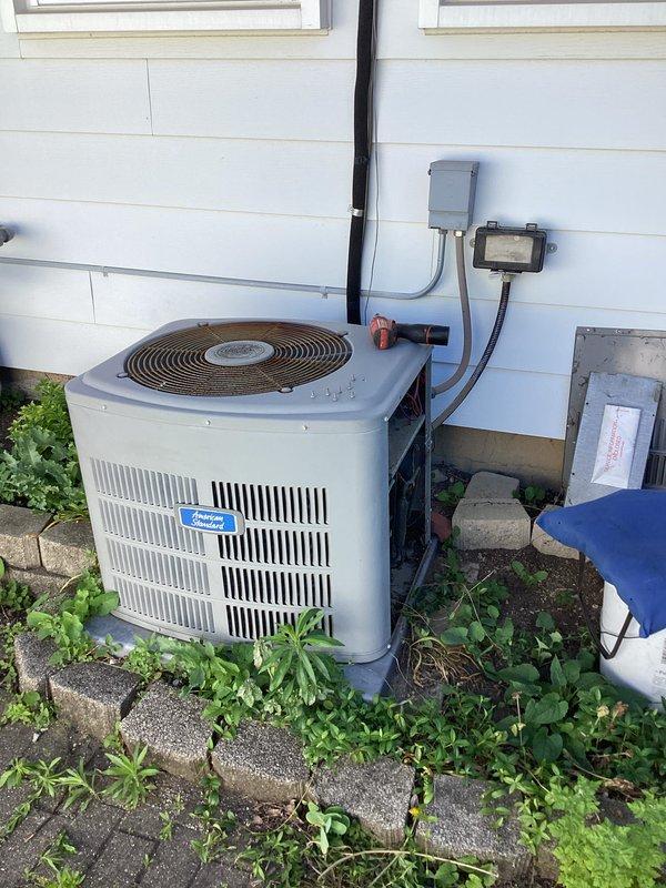 Responded to no cooling call where thermostat would not switch over from heating to cooling mode. Performed diagnostic evaluation of the HVAC system including inspection of the outdoor condensing unit, electrical disconnect, and thermostat wiring at the exterior junction box. Verified proper power supply to the air conditioning unit and checked for any visible wiring issues or loose connections that could prevent the system from switching modes. The outdoor unit and associated electrical components showed normal wear consistent with age and outdoor exposure.