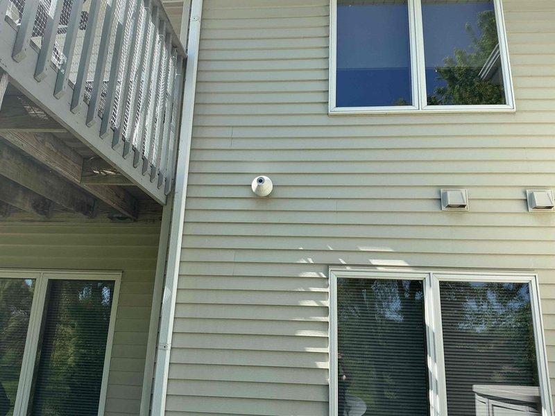 Conducted estimate for replacement of 24-year-old air conditioning system that is no longer cooling properly. Evaluated existing natural gas furnace and AC unit located in open basement area, inspected electrical panel showing dedicated AC circuits, and assessed exterior installation requirements including venting configuration on residential siding. Provided replacement options and recommendations for new HVAC system.