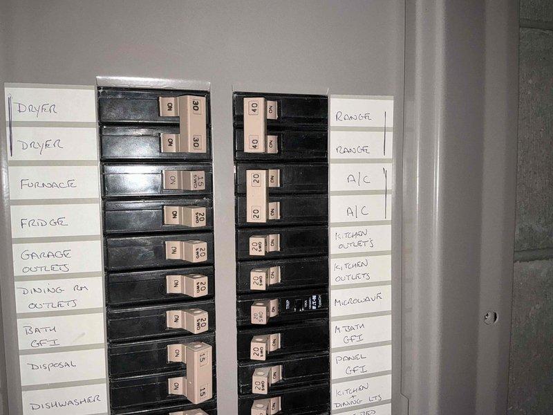 Conducted estimate for replacement of 24-year-old air conditioning system that is no longer cooling properly. Evaluated existing natural gas furnace and AC unit located in open basement area, inspected electrical panel showing dedicated AC circuits, and assessed exterior installation requirements including venting configuration on residential siding. Provided replacement options and recommendations for new HVAC system.